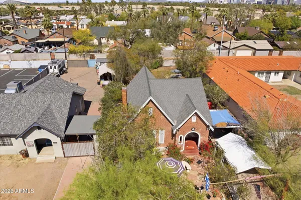 an aerial view of residential houses with outdoor space