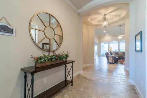 a lobby with furniture and wooden floor