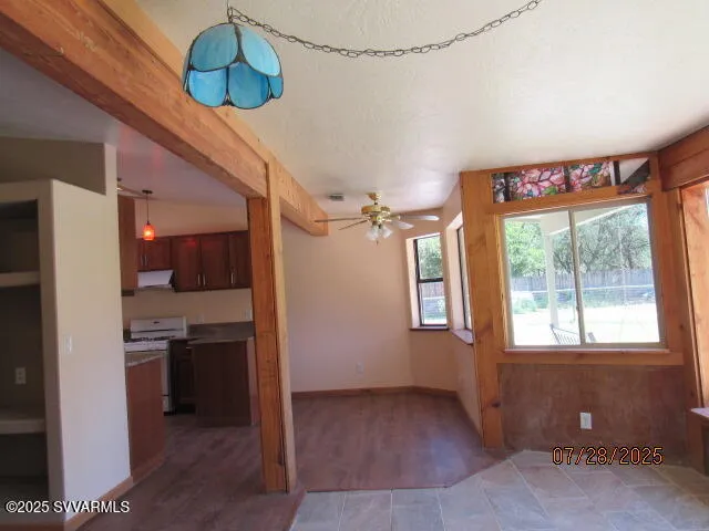 a view of a room with window and cabinet