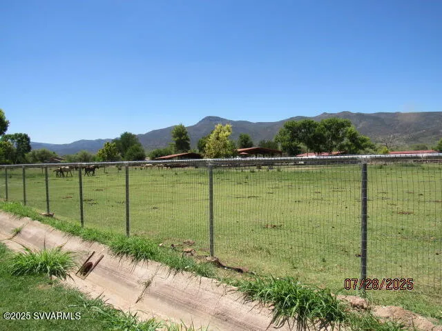 a view of a lake with a big yard