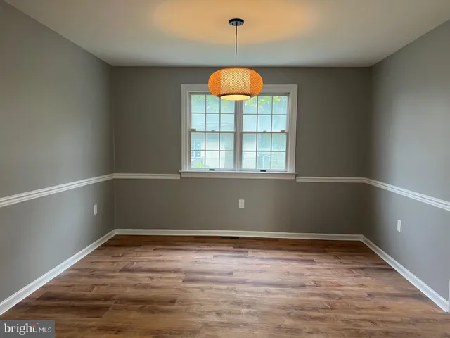 a kitchen with a stove and cabinets