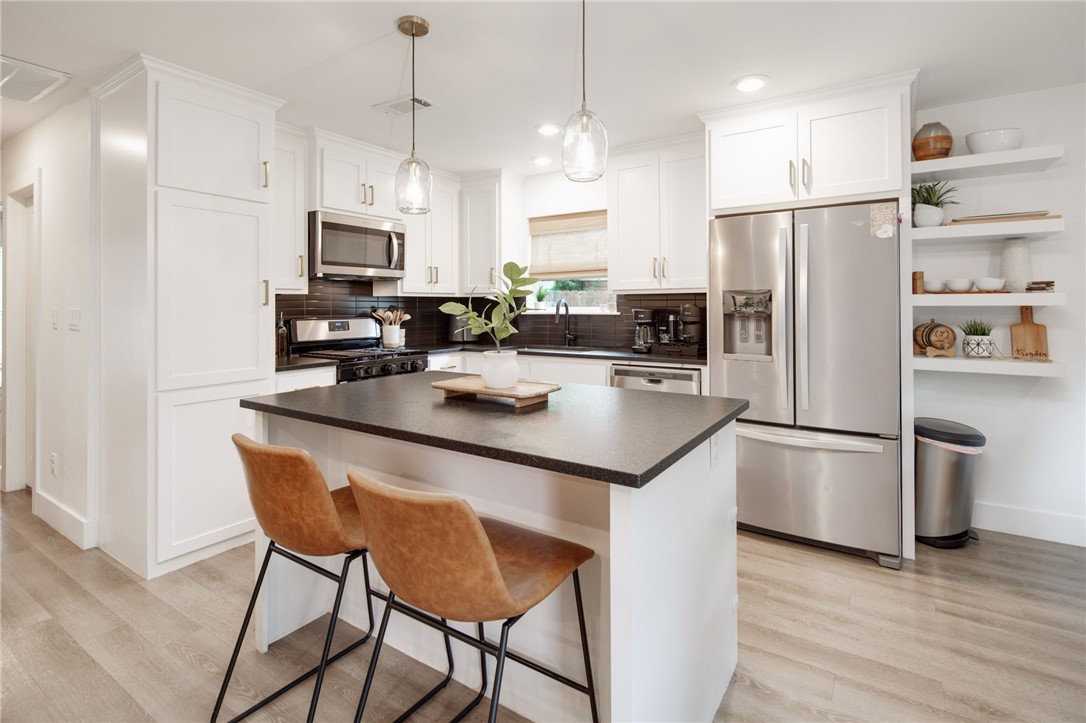 4700 Kensington Road Bryan, TX 77802 - Photo 9 of 31 Modern kitchen white shaker cabinetry and gold finishes