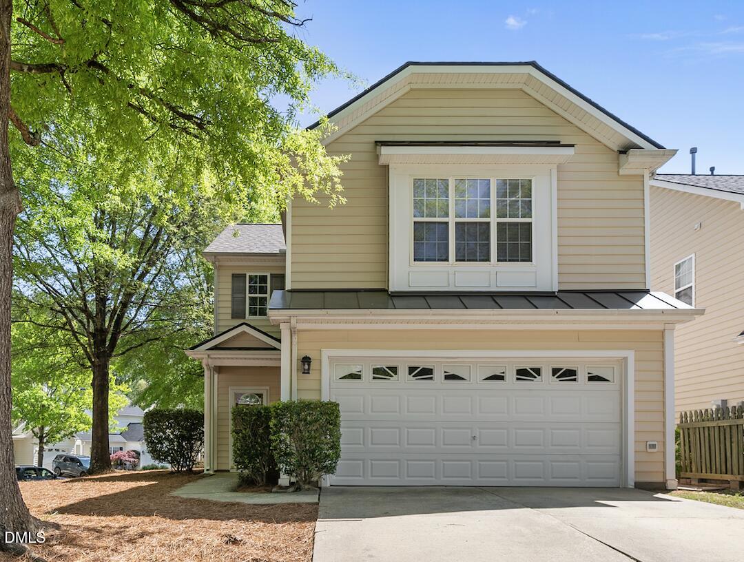 1024 Goldmist Lane Durham, NC 27713 - Photo 1 of 46 a front view of a house with a garden