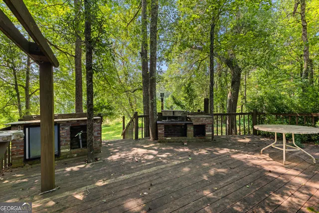 a view of a patio with swimming pool table and chairs