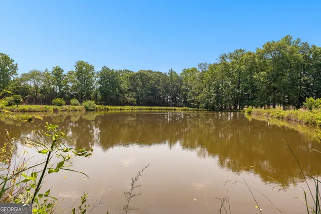 a view of a porch with furniture and yard