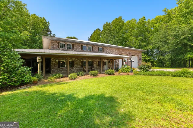 a living room with fireplace furniture and a flat screen tv