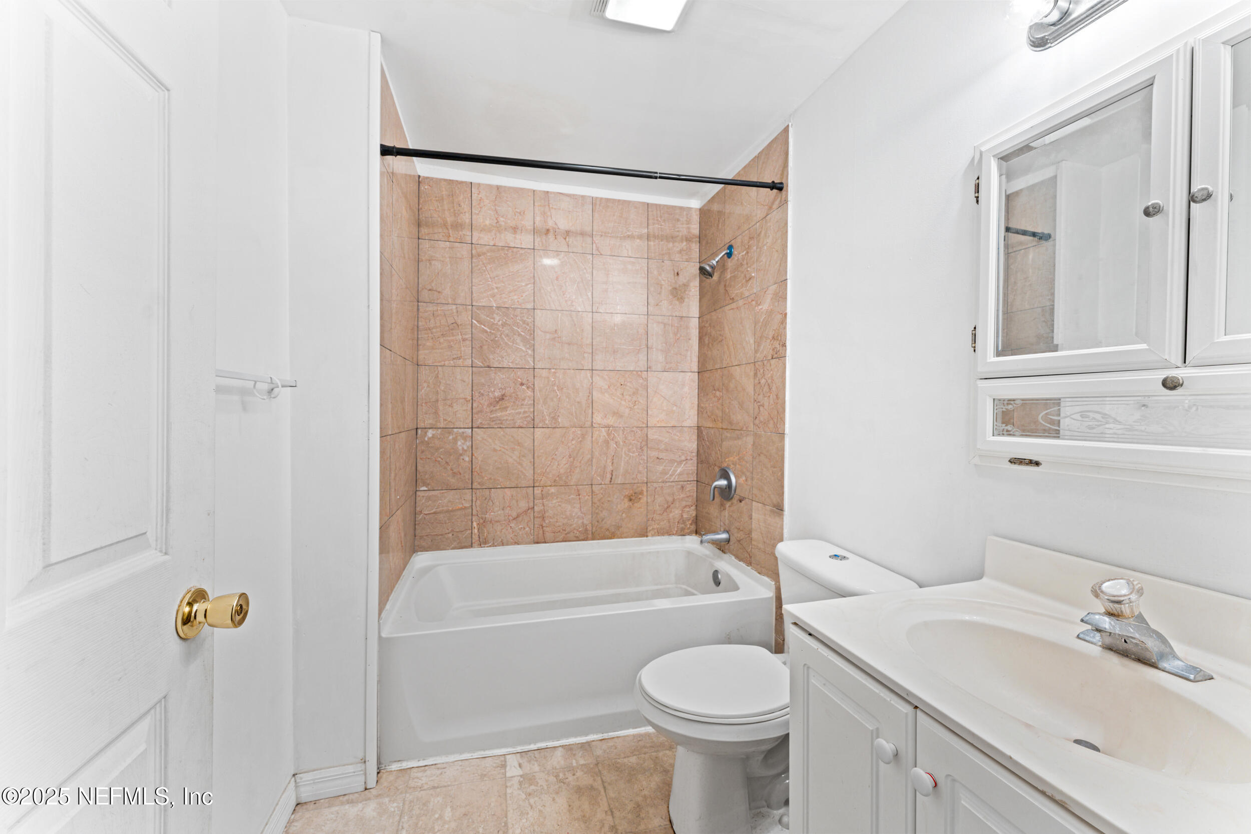 610 Division Street Fernandina Beach, FL 32034 - Photo 16 of 40 a bathroom with a sink toilet and shower