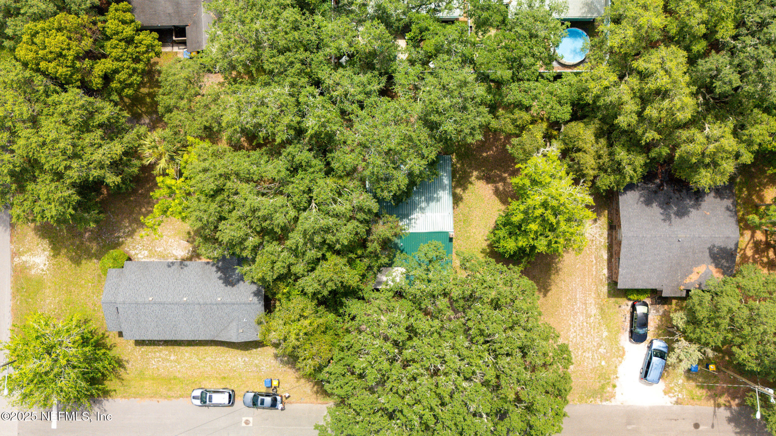 610 Division Street Fernandina Beach, FL 32034 - Photo 38 of 40 an aerial view of a house with a yard and garden