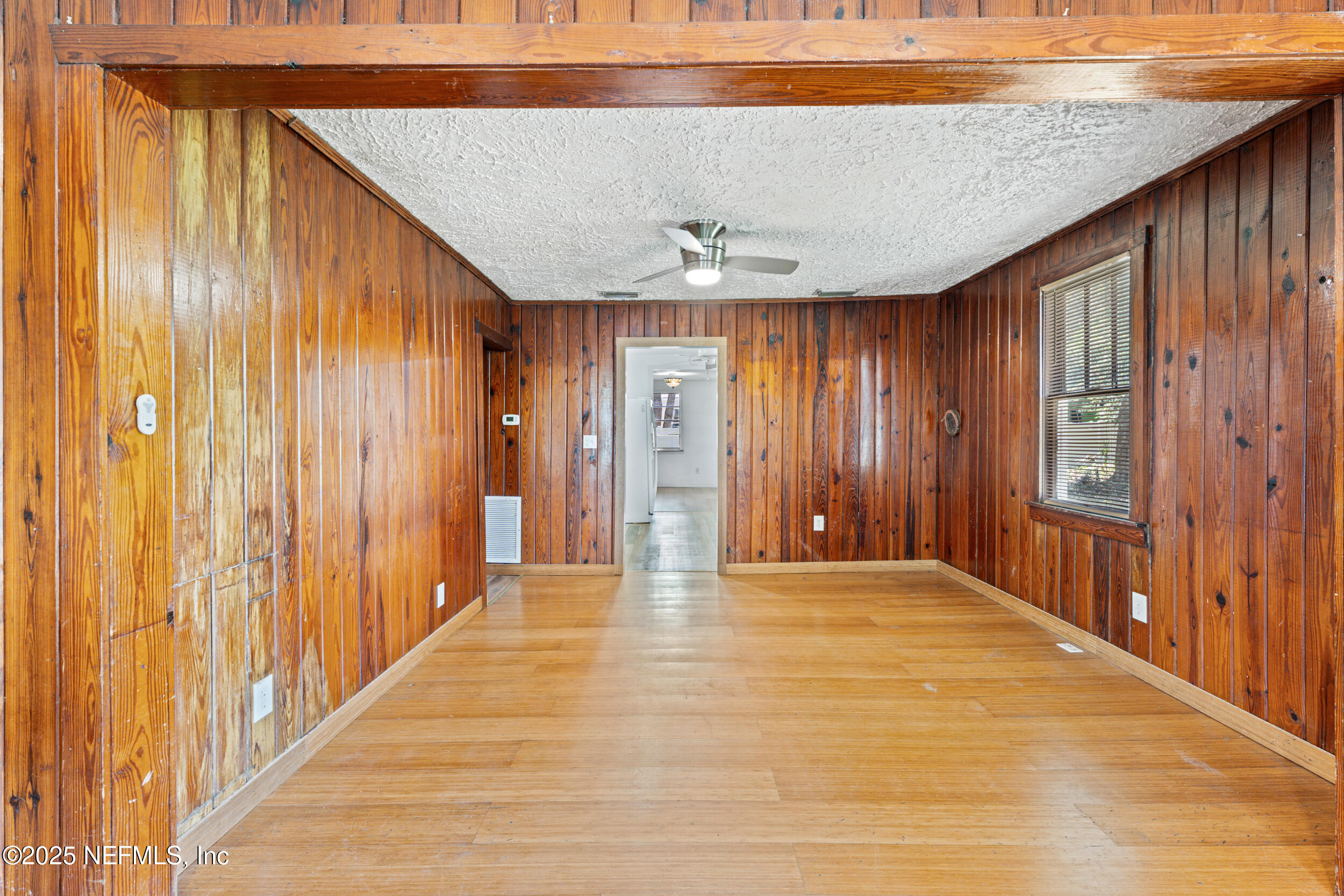 610 Division Street Fernandina Beach, FL 32034 - Photo 8 of 40 a view of an empty room with wooden floor
