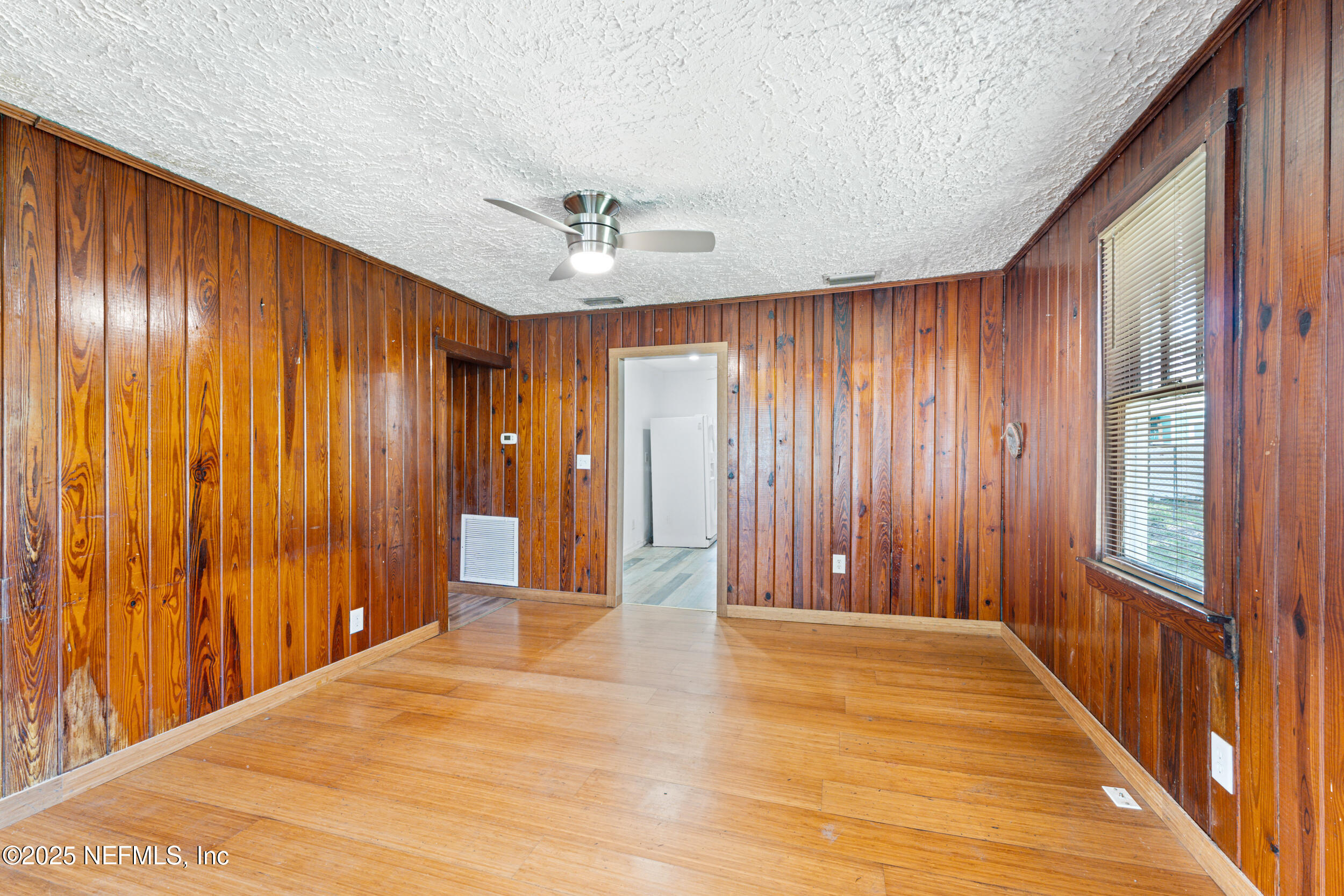 610 Division Street Fernandina Beach, FL 32034 - Photo 9 of 40 a view of a room with wooden walls