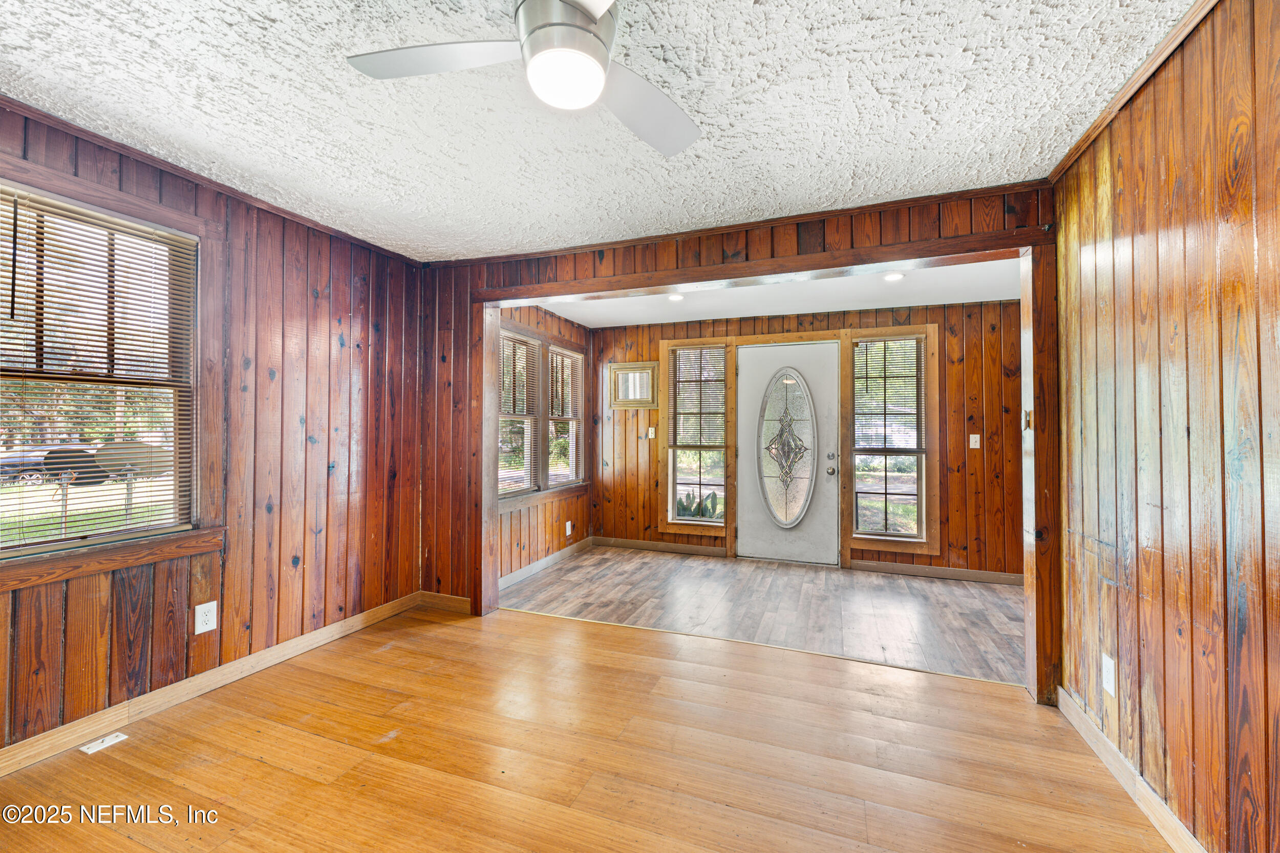 610 Division Street Fernandina Beach, FL 32034 - Photo 10 of 40 a big room with wooden floor and windows