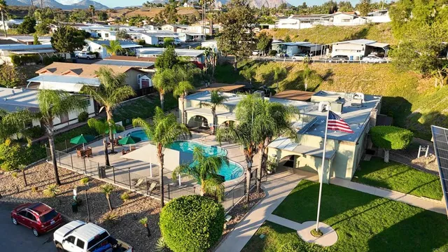 an aerial view of residential houses with outdoor space