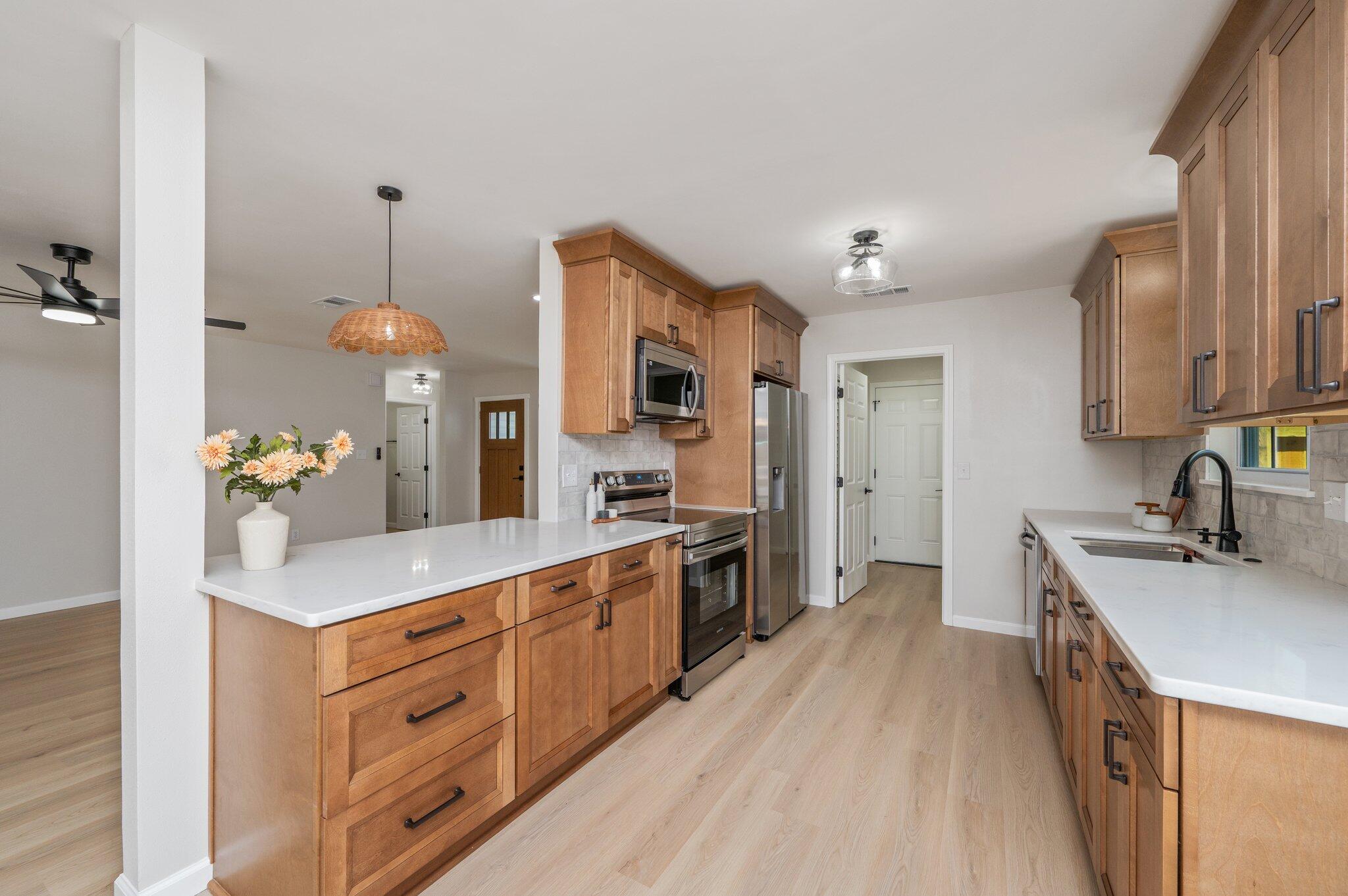 55 Ruby Circle Mary Esther, FL 32569 - Photo 13 of 51 a kitchen with stainless steel appliances a sink stove and refrigerator