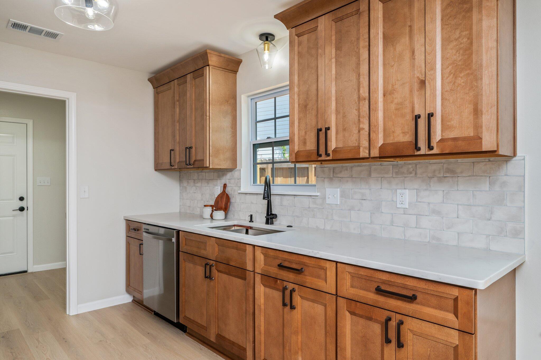 55 Ruby Circle Mary Esther, FL 32569 - Photo 15 of 51 a kitchen with stainless steel appliances granite countertop a sink a stove and cabinets