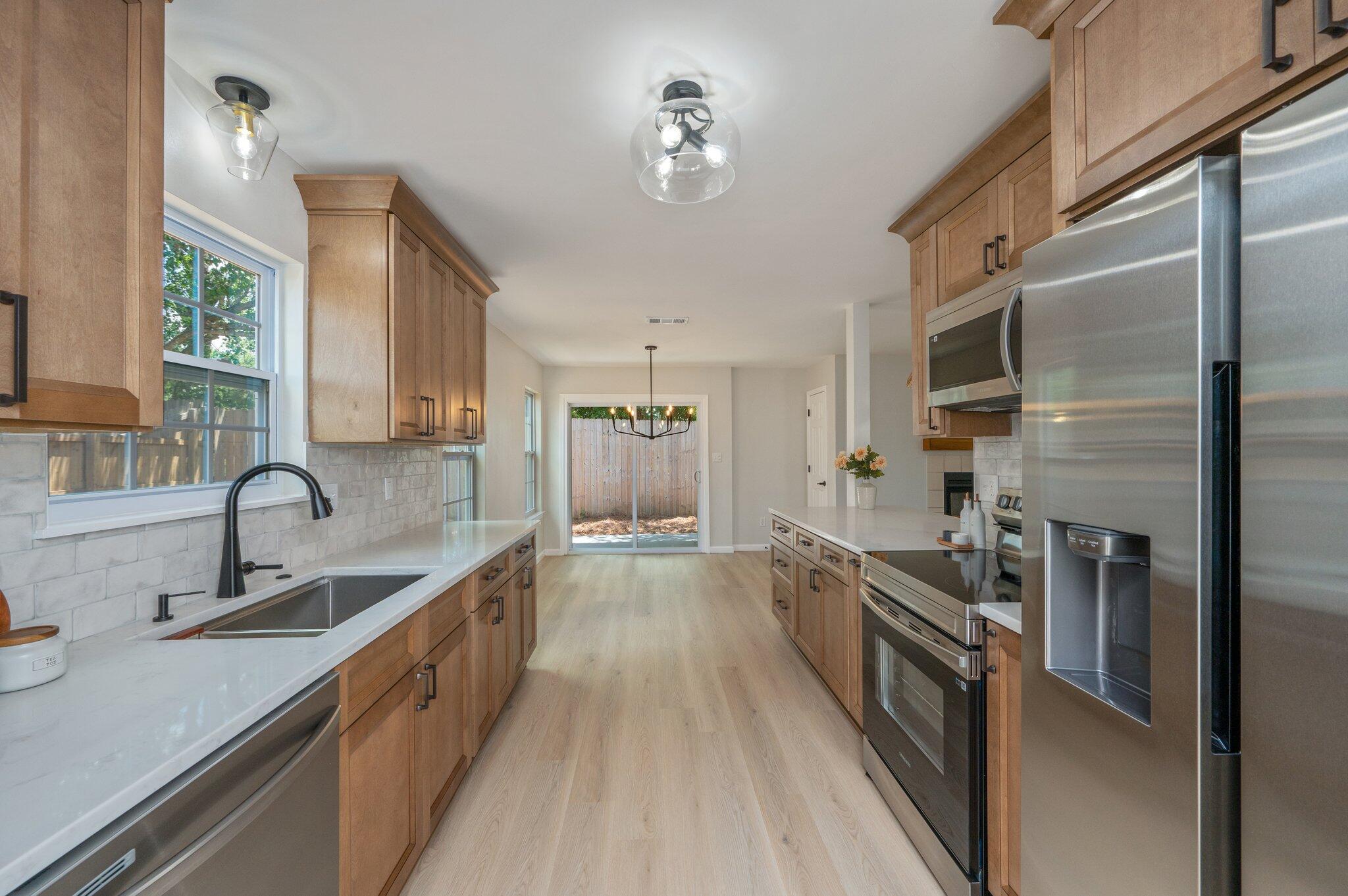 55 Ruby Circle Mary Esther, FL 32569 - Photo 18 of 51 a large kitchen with stainless steel appliances a sink stove and refrigerator