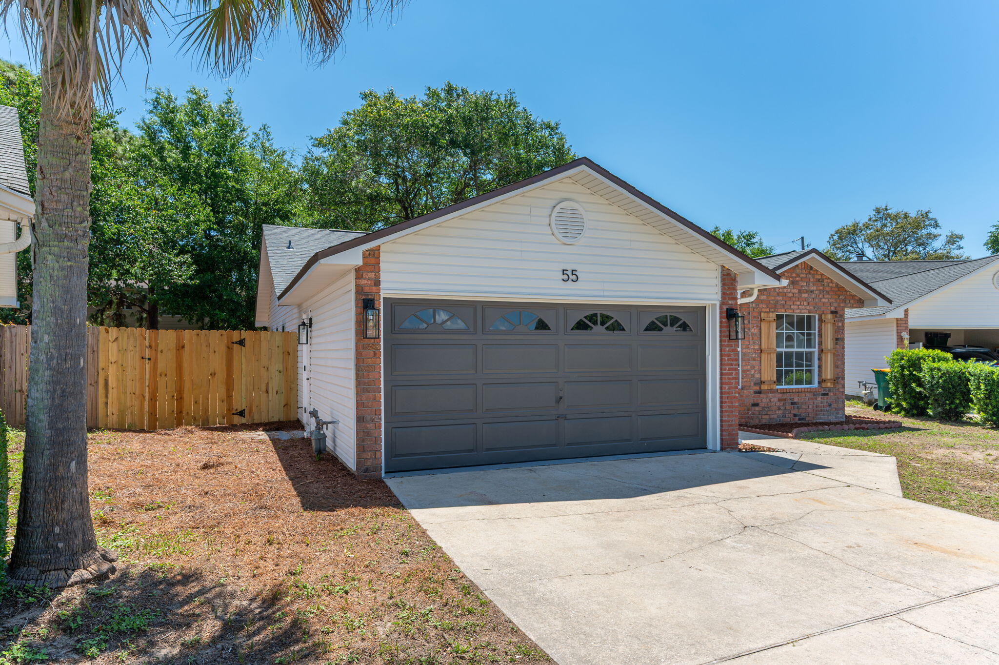 55 Ruby Circle Mary Esther, FL 32569 - Photo 2 of 51 a front view of a house with a garage