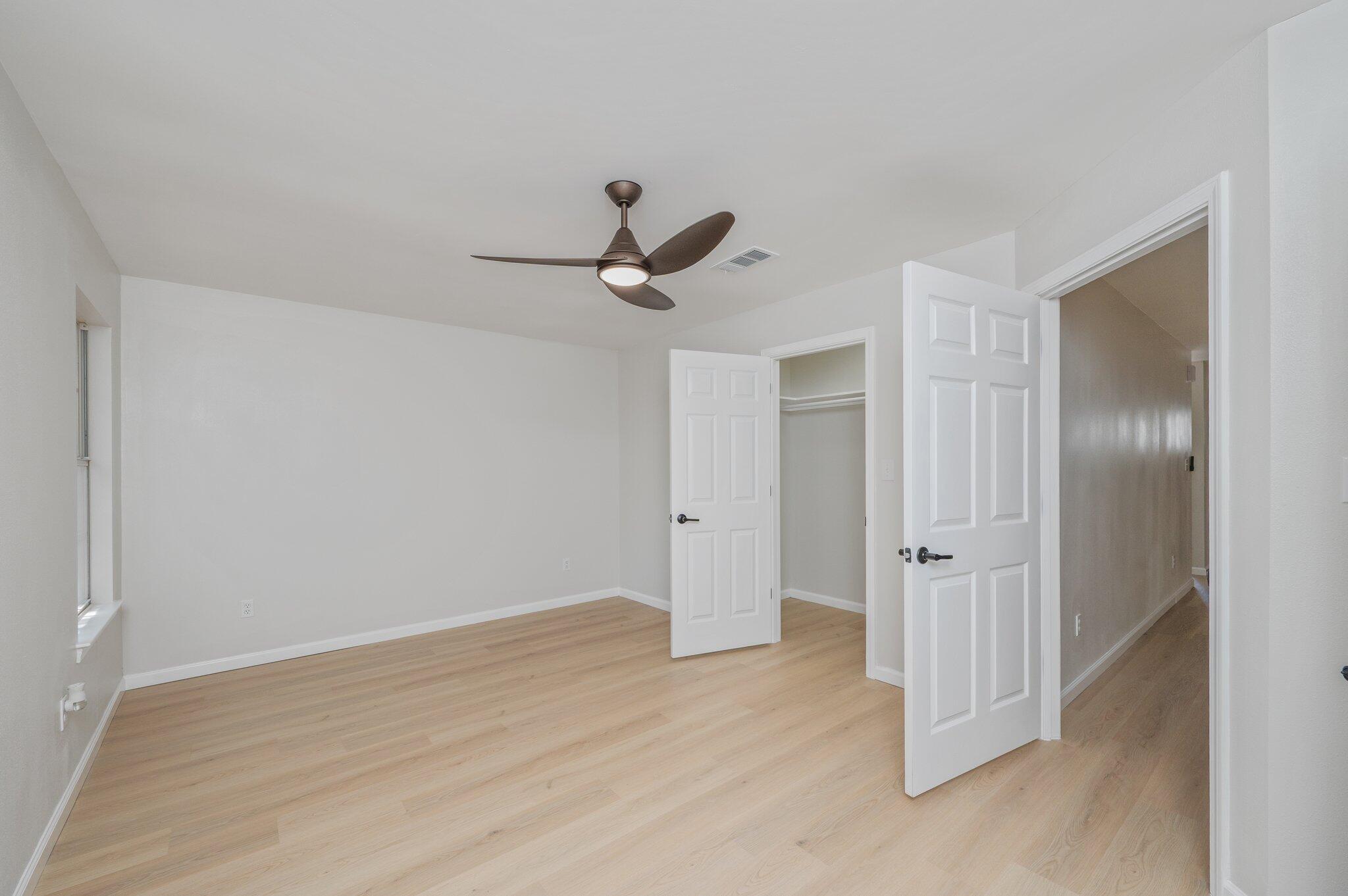 55 Ruby Circle Mary Esther, FL 32569 - Photo 27 of 51 a view of a livingroom with a ceiling fan and wooden floor