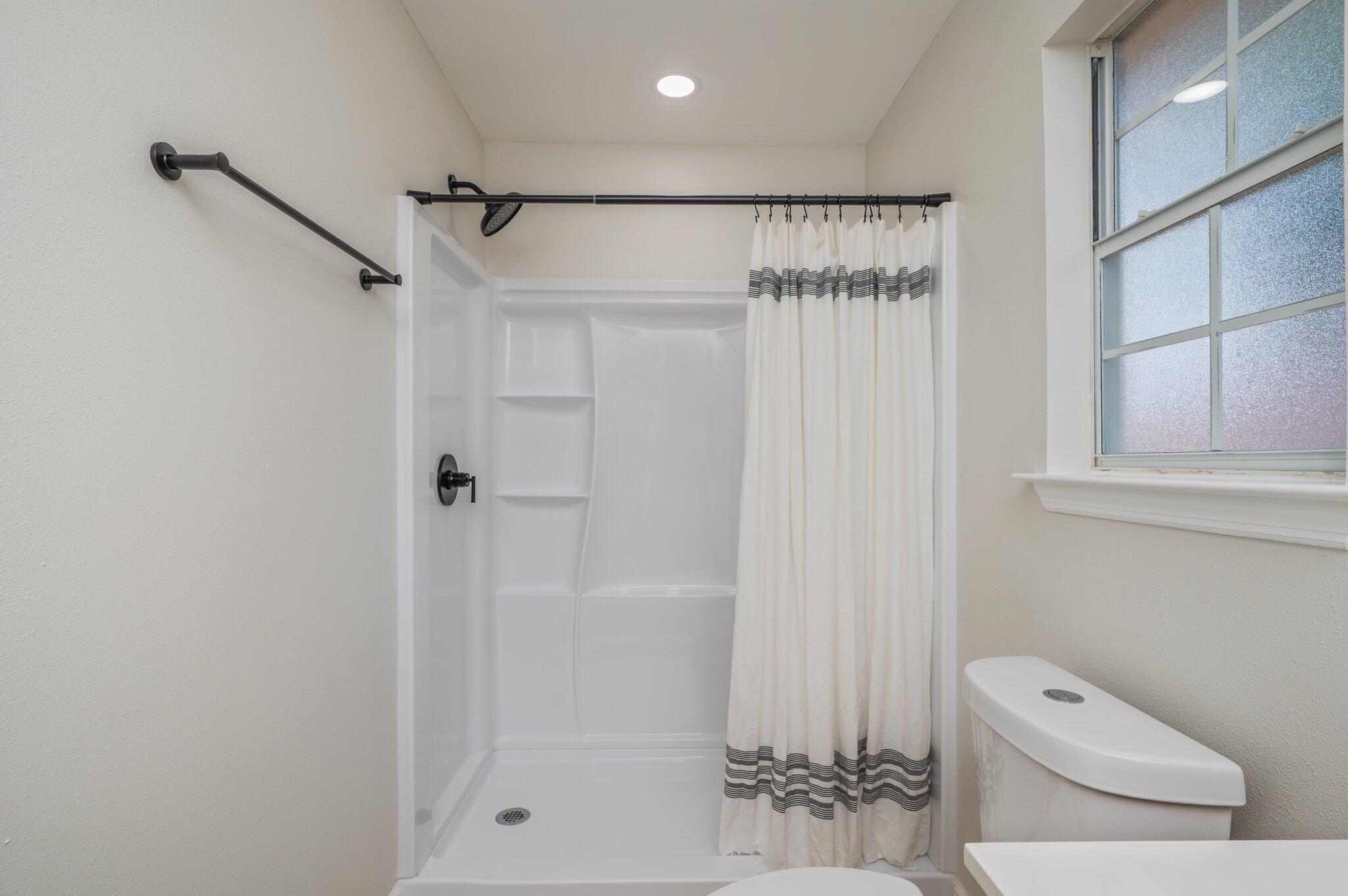 55 Ruby Circle Mary Esther, FL 32569 - Photo 29 of 51 a bathroom with a shower a toilet and sink