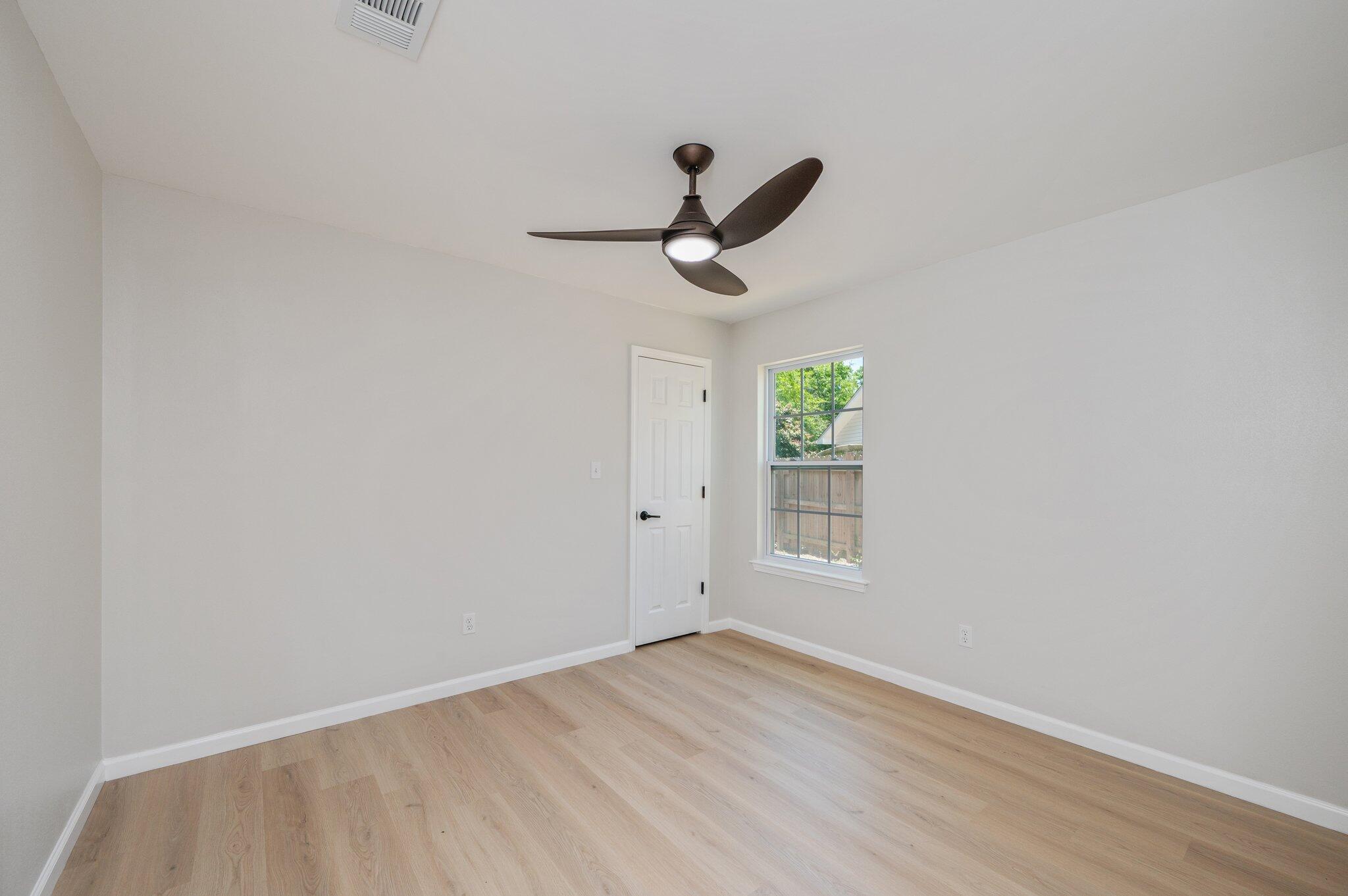 55 Ruby Circle Mary Esther, FL 32569 - Photo 34 of 51 a view of empty room with wooden floor and window