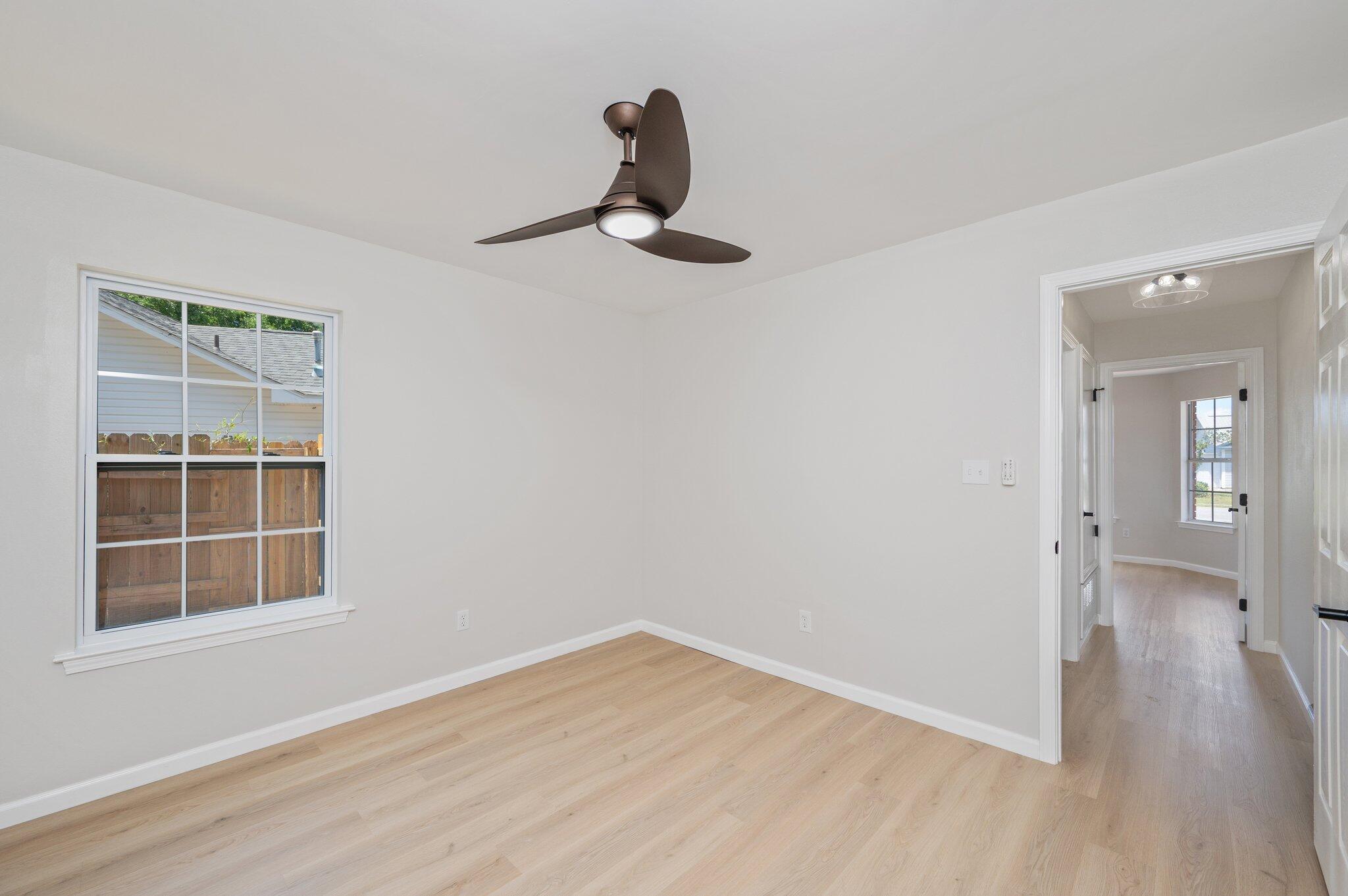 55 Ruby Circle Mary Esther, FL 32569 - Photo 35 of 51 a view of empty room with wooden floor and windows