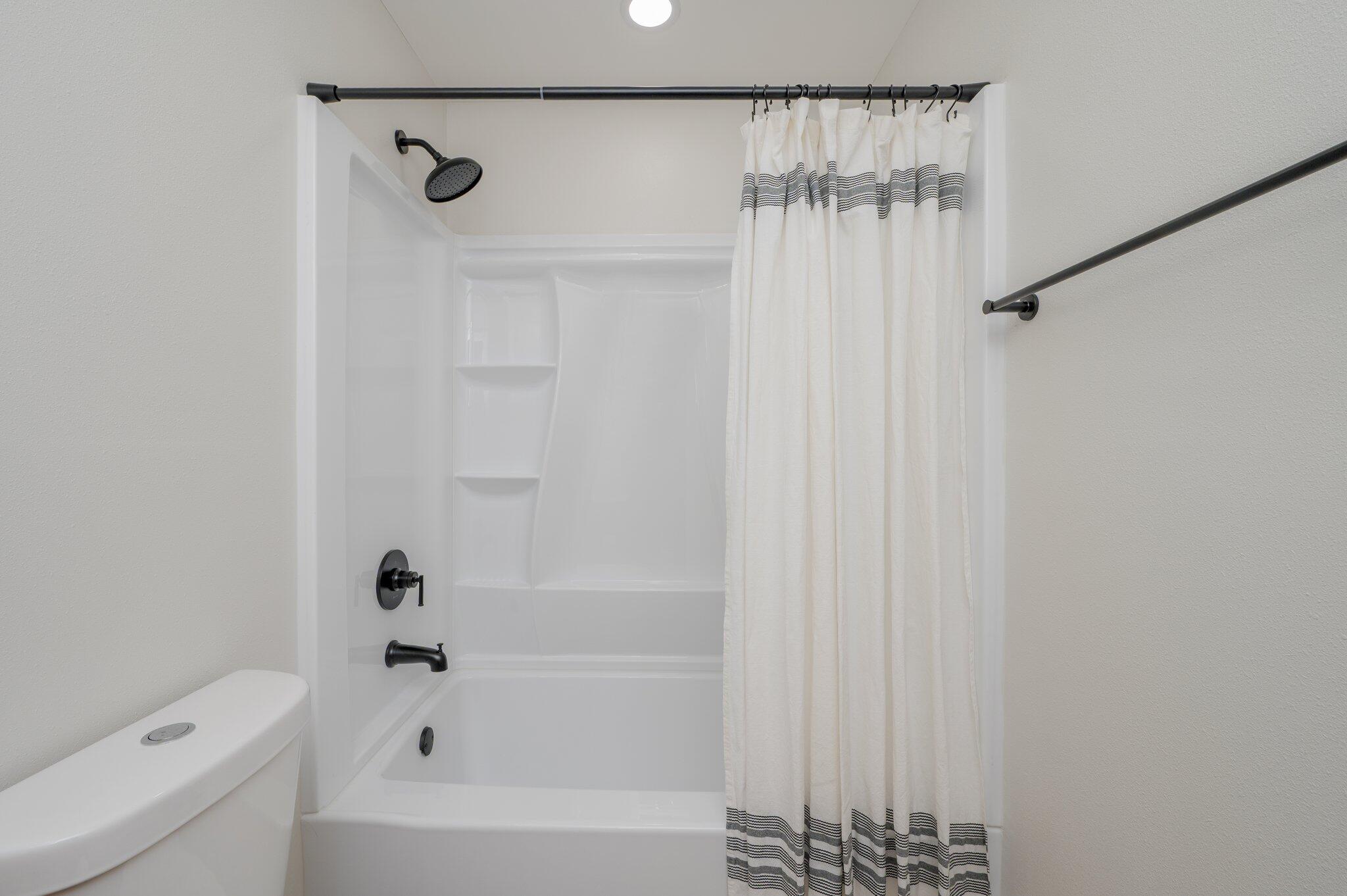 55 Ruby Circle Mary Esther, FL 32569 - Photo 37 of 51 a bathroom with a shower and a tub