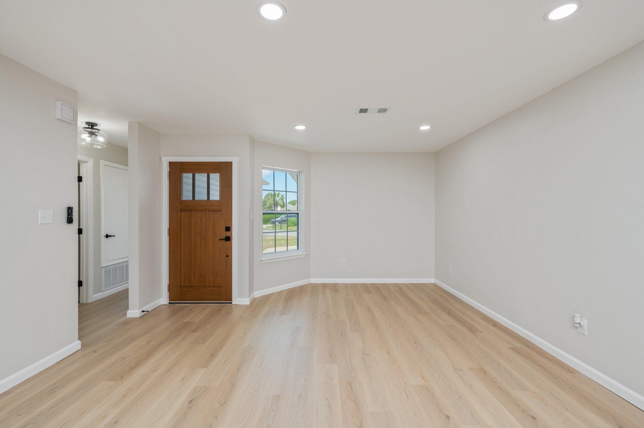 55 Ruby Circle Mary Esther, FL 32569 - Photo 3 of 51 wooden floor in an empty room with a window