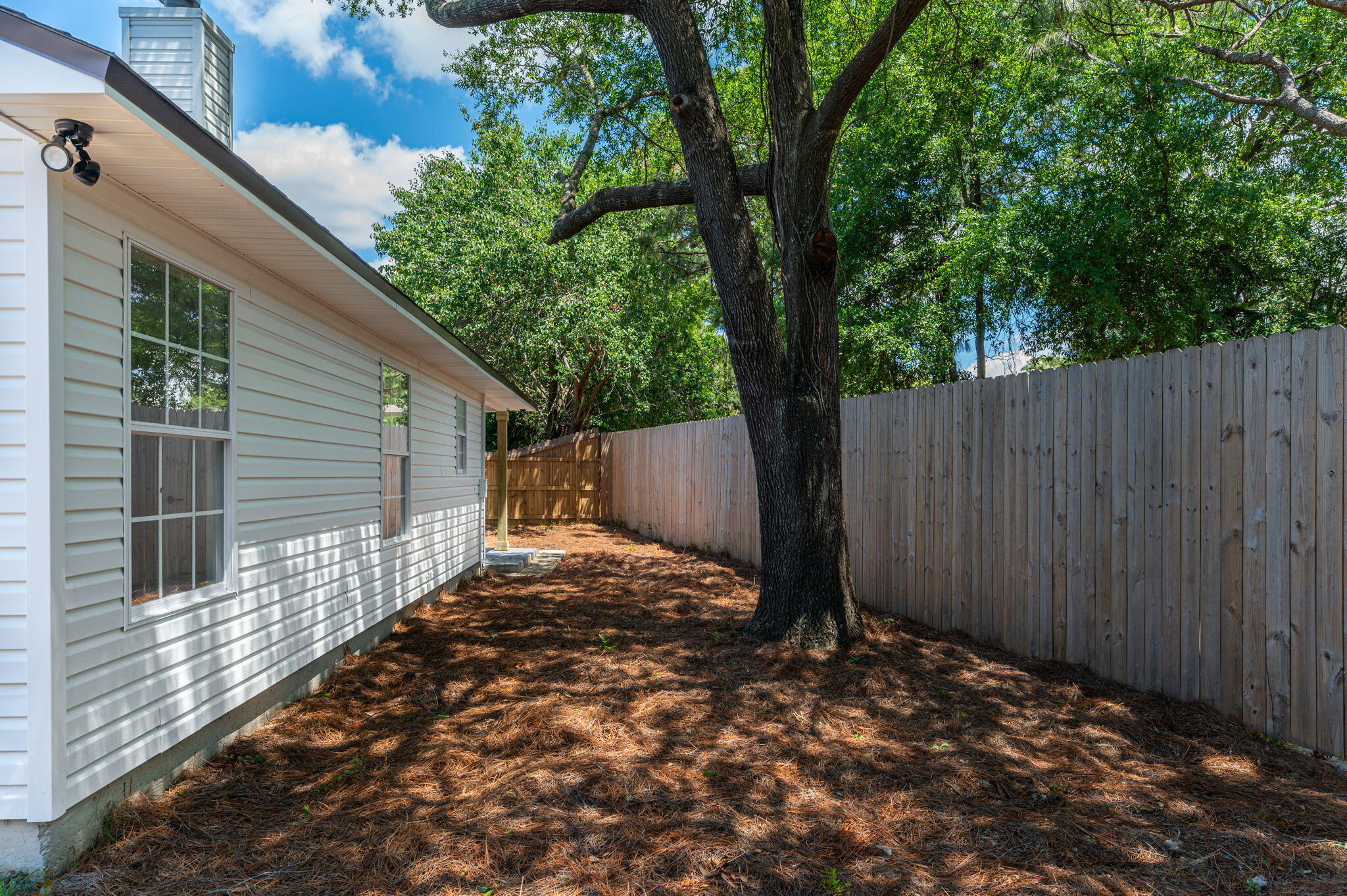 55 Ruby Circle Mary Esther, FL 32569 - Photo 45 of 51 a backyard of a house with lots of green space