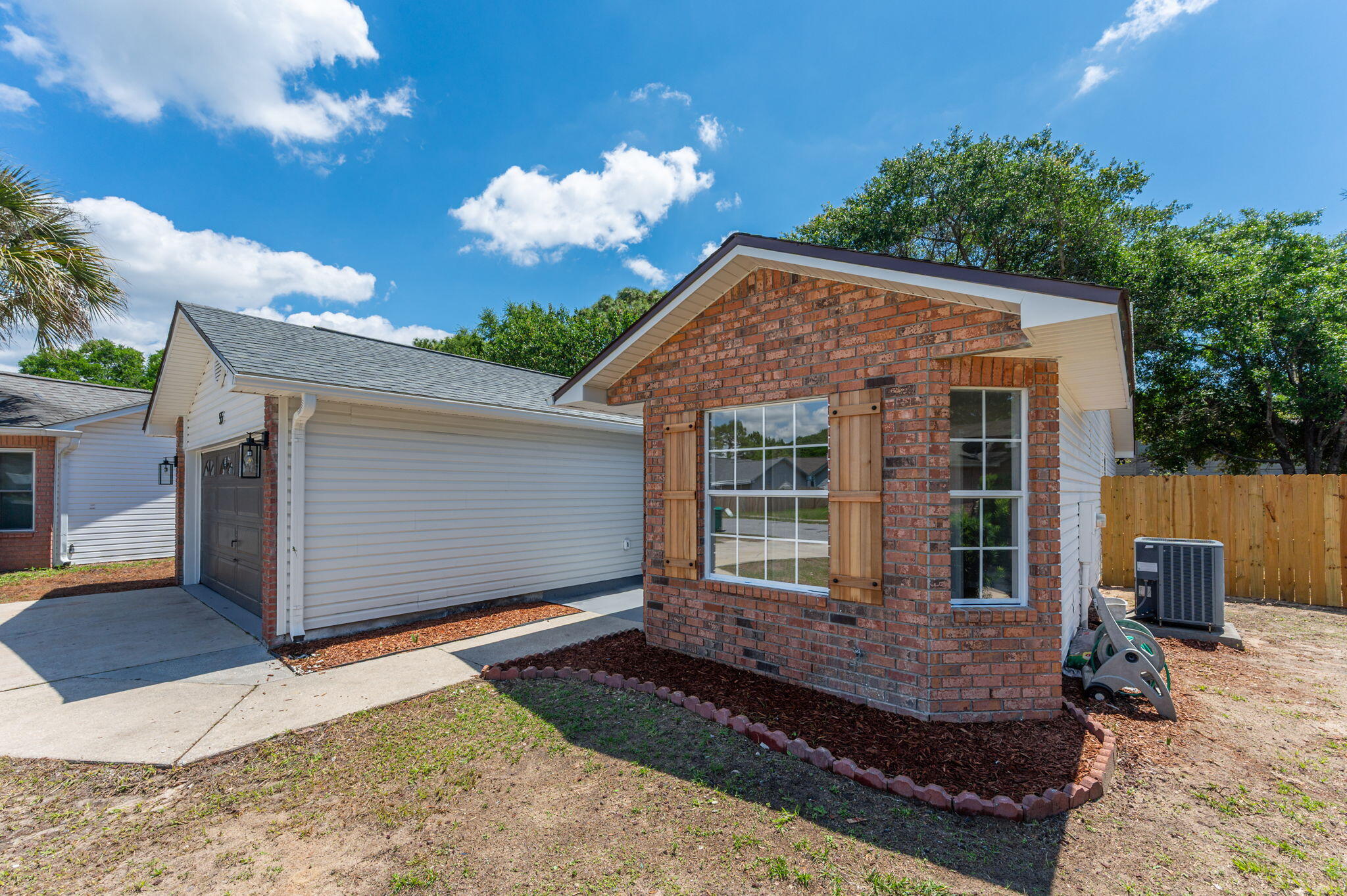 55 Ruby Circle Mary Esther, FL 32569 - Photo 49 of 51 a front view of a house with a yard