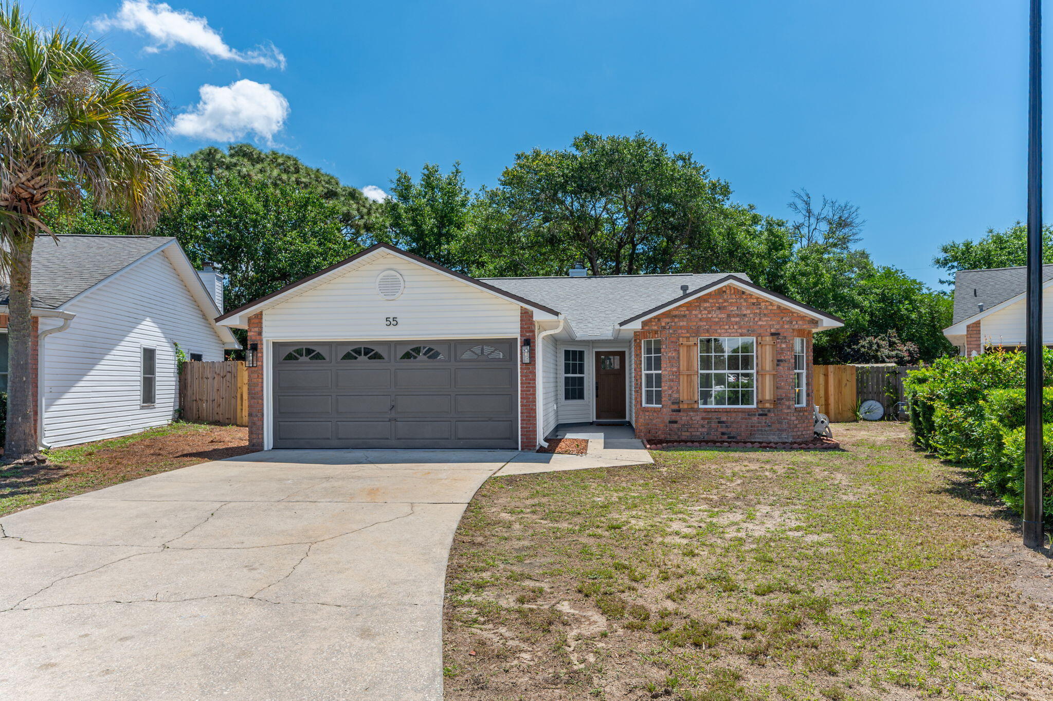 55 Ruby Circle Mary Esther, FL 32569 - Photo 50 of 51 a front view of a house with yard and garage