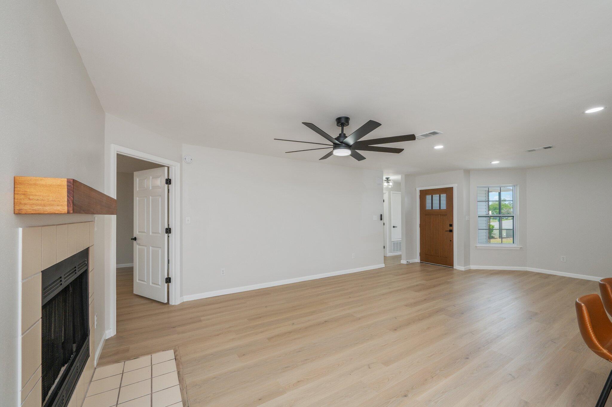 55 Ruby Circle Mary Esther, FL 32569 - Photo 8 of 51 a view of an empty room with window and wooden floor
