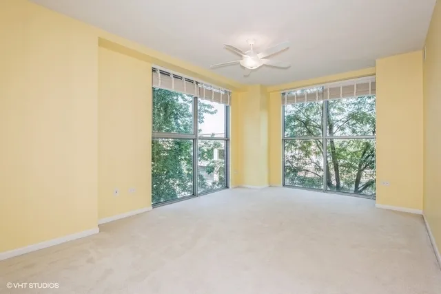 a view of an empty room with windows