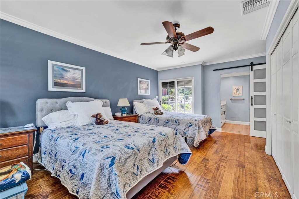 5456 Cadbury Road Whittier, CA 90601 - Photo 25 of 67 a bed room with a bed and a chandelier