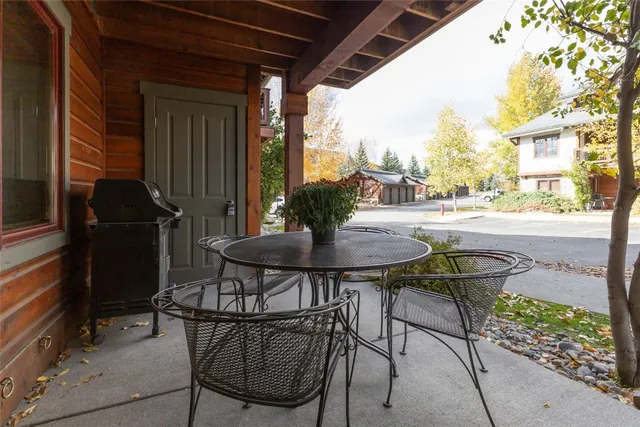 a view of a chairs and table in a patio