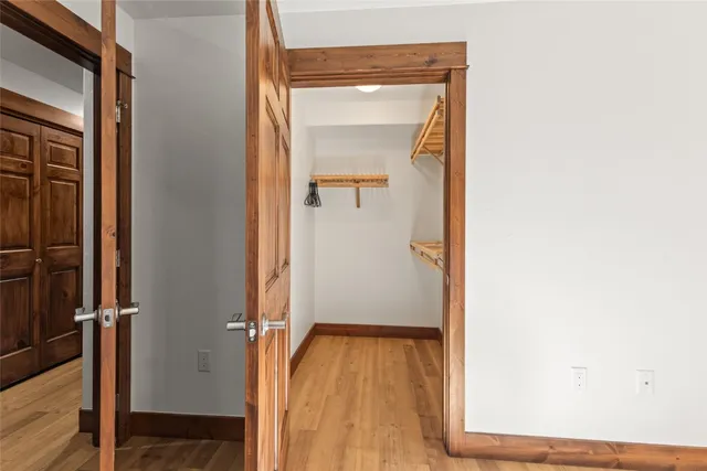 a bathroom with a granite countertop sink a toilet and mirror