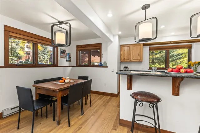 a dining room with furniture and window
