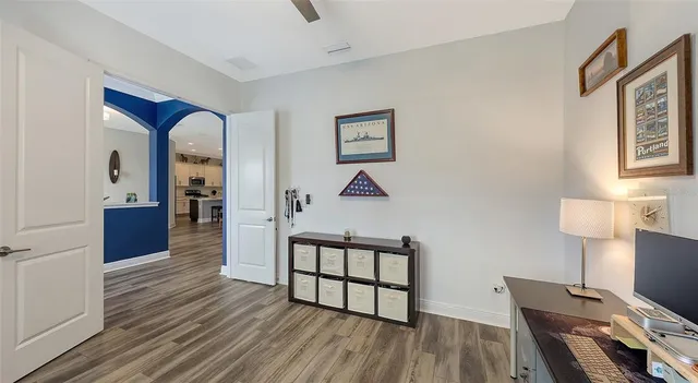 a bathroom with a sink vanity granite toilet and shower