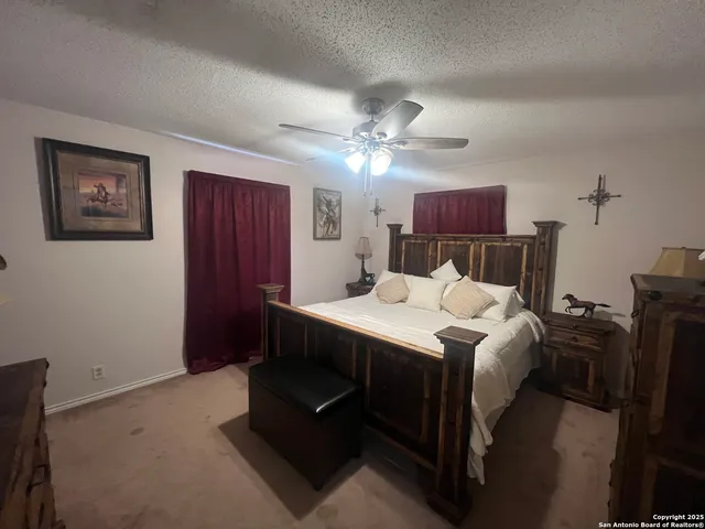a bed room with a bed and a chandelier