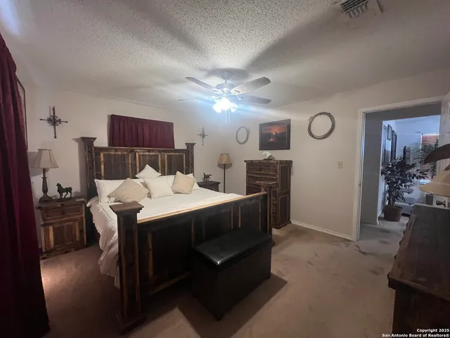 a bed room with a bed and a television