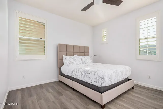 a bedroom with a bed and cabinets