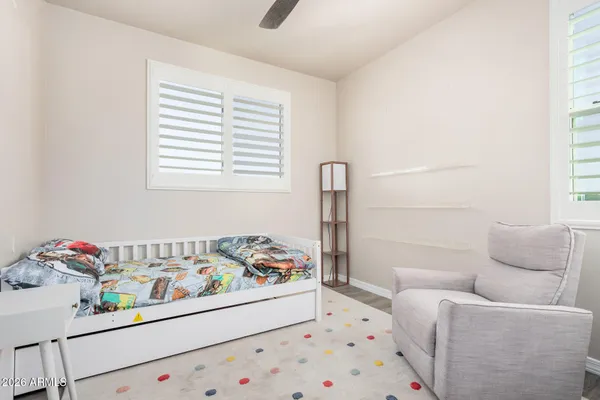 a bedroom with a bed and a couch