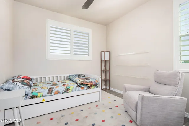 a bedroom with a bed and a couch