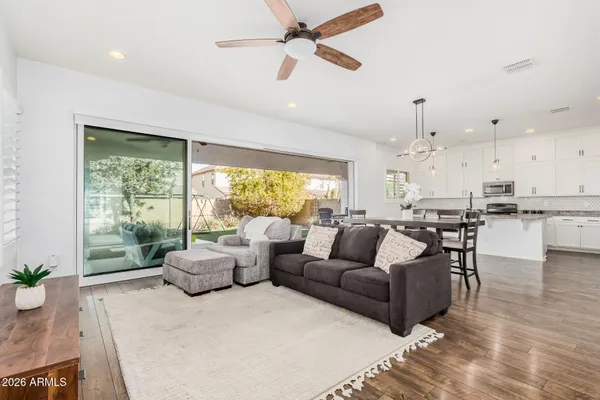 a living room with furniture and a large window