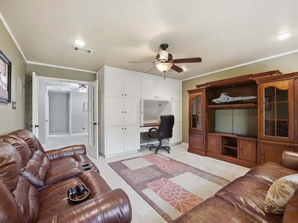 a bed room with a bed and a television