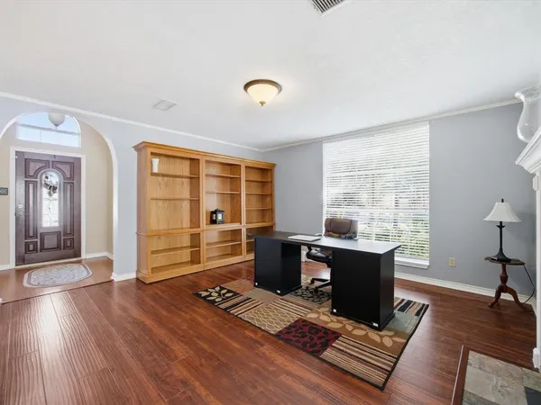 a view of workspace with wooden floor outdoor view and windows