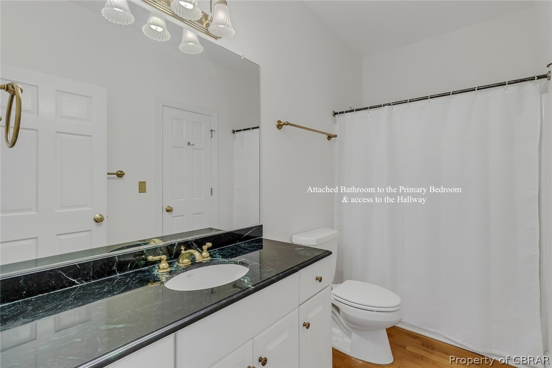 5818 Rivers Landing Terrace, Unit 5818 White Stone, VA 22578 - Photo 21 of 50 Bathroom with toilet, hardwood / wood-style floors, and large vanity