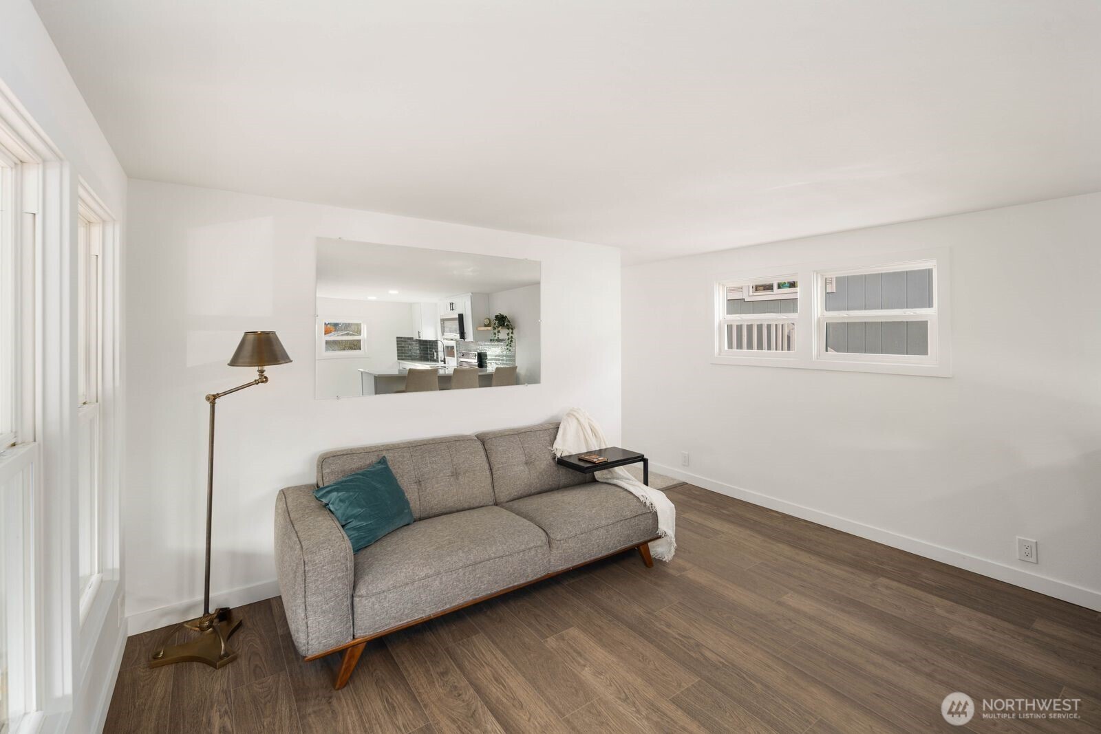 3333 228th Street Southeast, Unit 69 Bothell, WA 98021 - Photo 17 of 26 a living room with furniture and a wooden floor