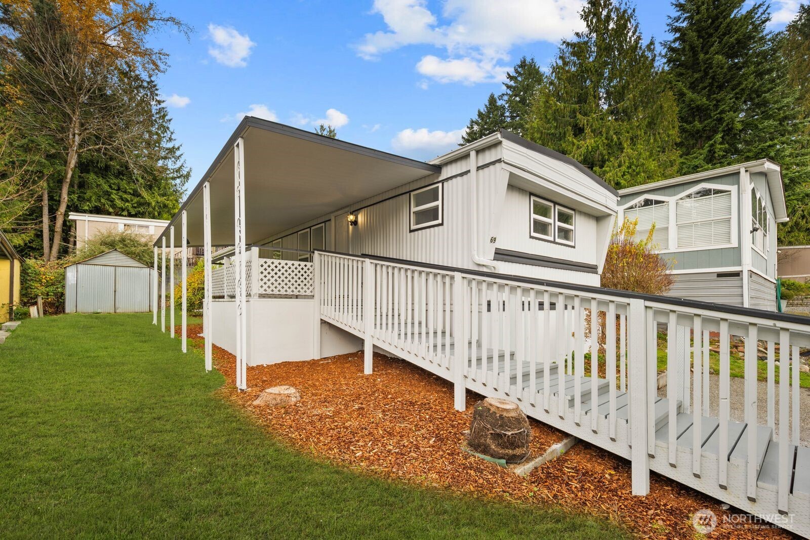 3333 228th Street Southeast, Unit 69 Bothell, WA 98021 - Photo 3 of 26 a view of balcony with deck and garden