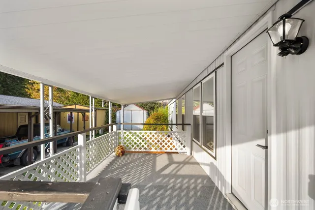 a view of a balcony with furniture