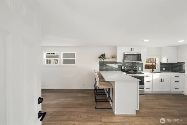 a view of a dining room with furniture