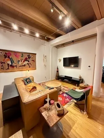 a room with furniture and flat screen tv